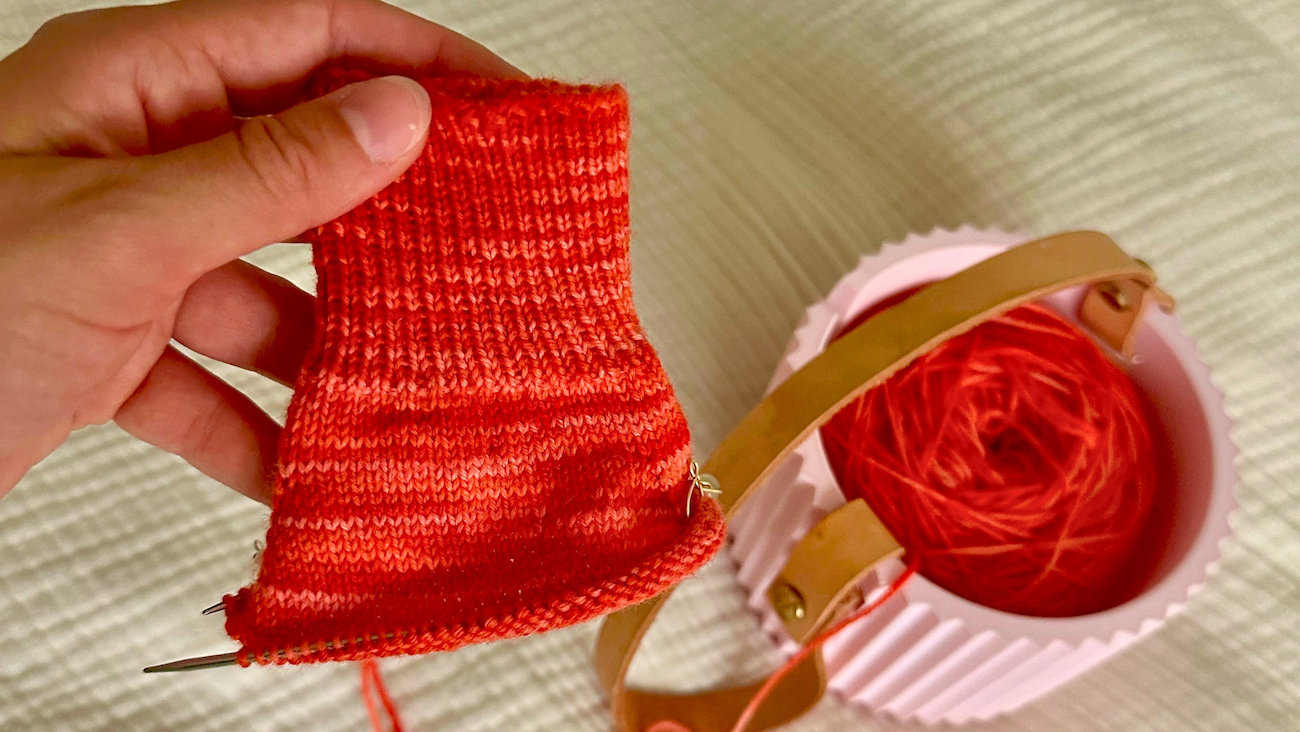 A pair of hand-knitted socks made with the Staple Sock knitting pattern