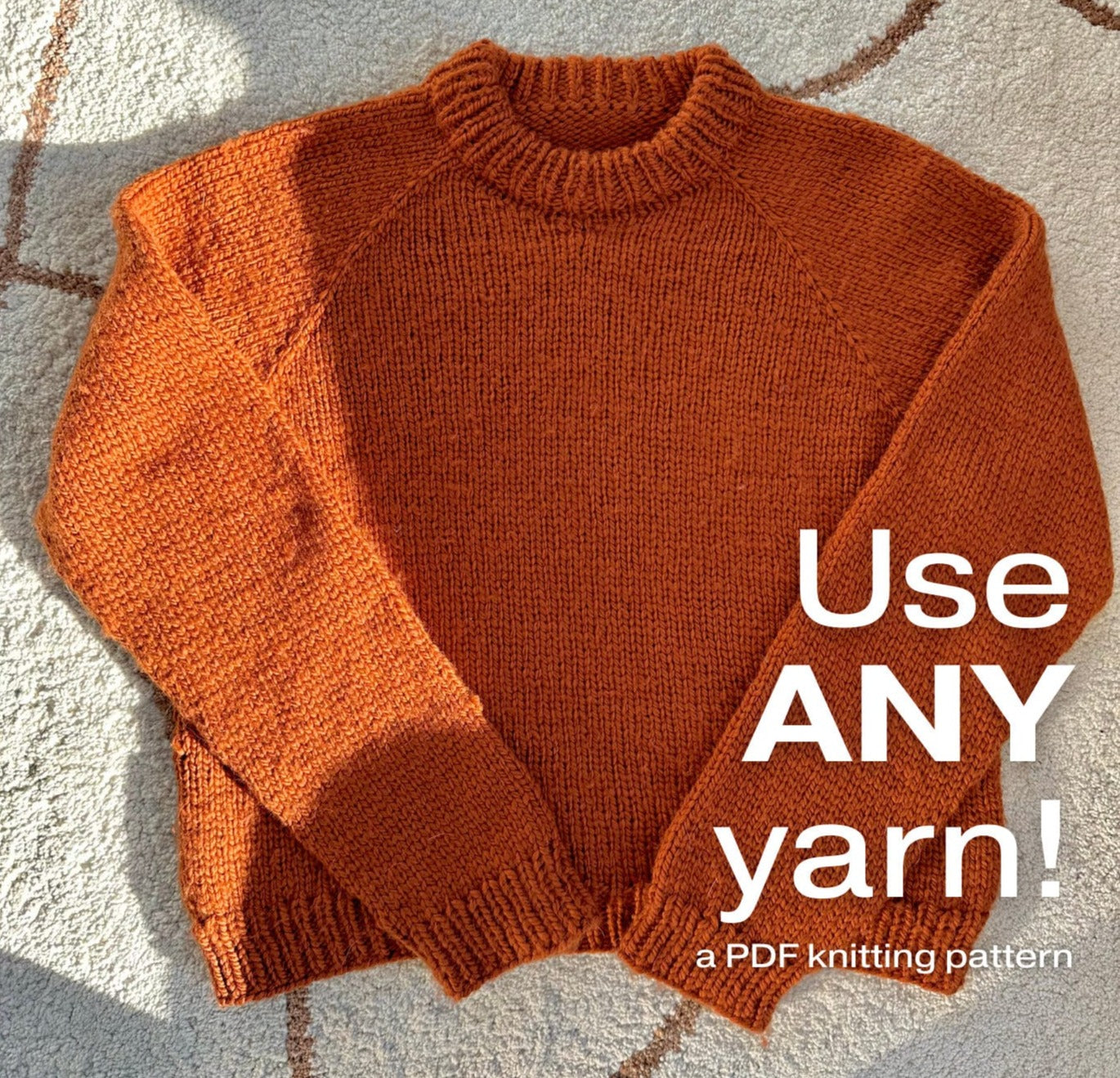 an orange knitted sweater with text "Use ANY yarn!"