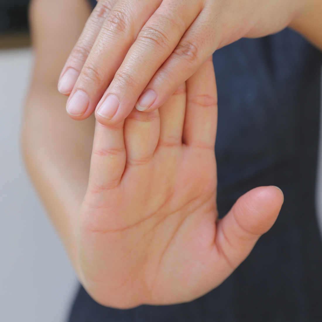 Close-up image of hand stretch highlighting essential stretches and exercises for knitters.