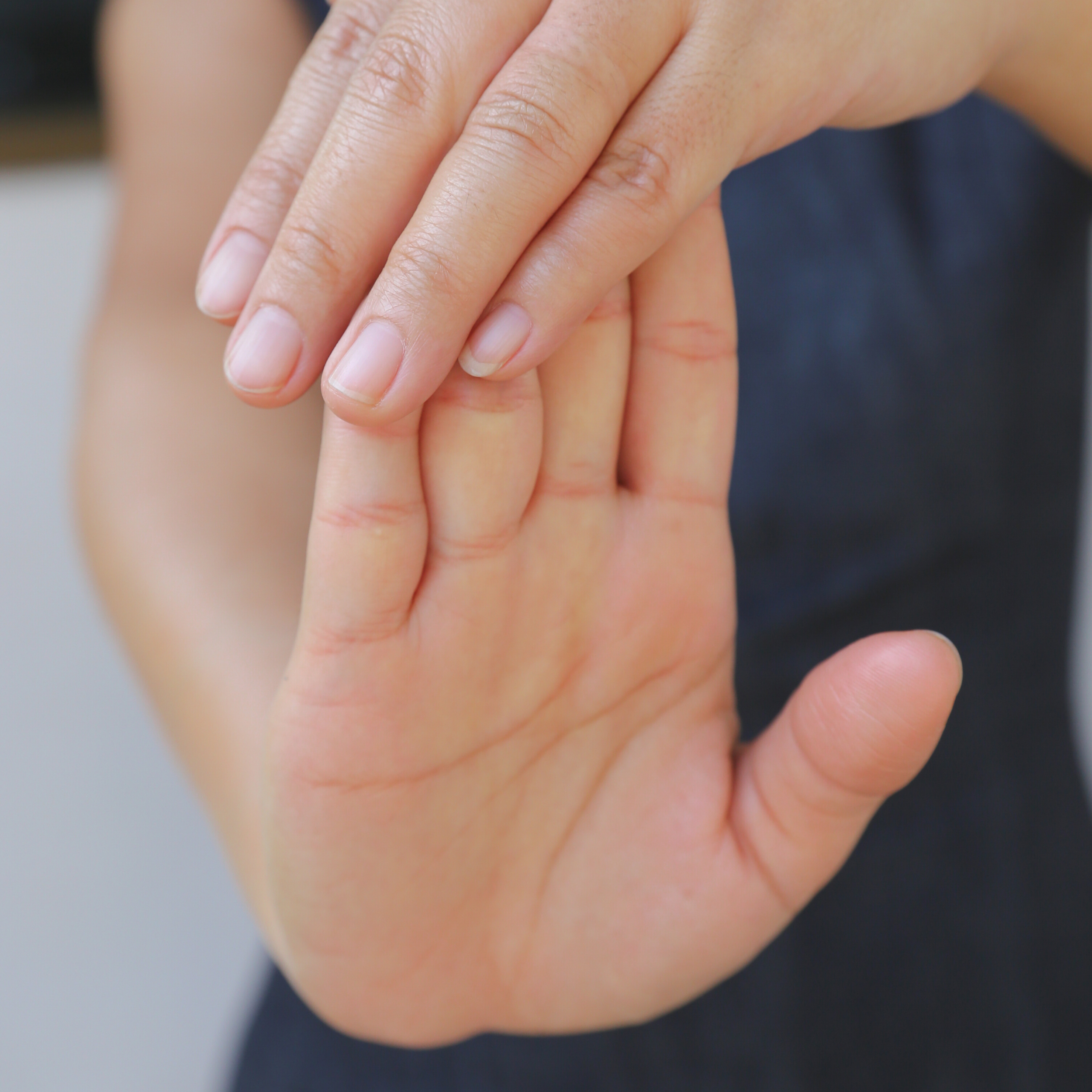 Close-up image of hand stretch highlighting essential stretches and exercises for knitters.