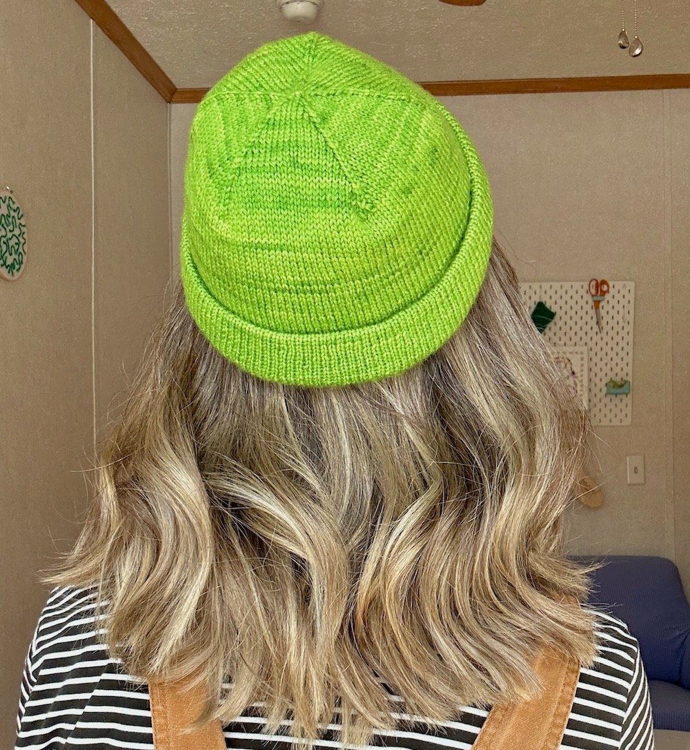 A woman wearing The Short Staple Beanie pattern