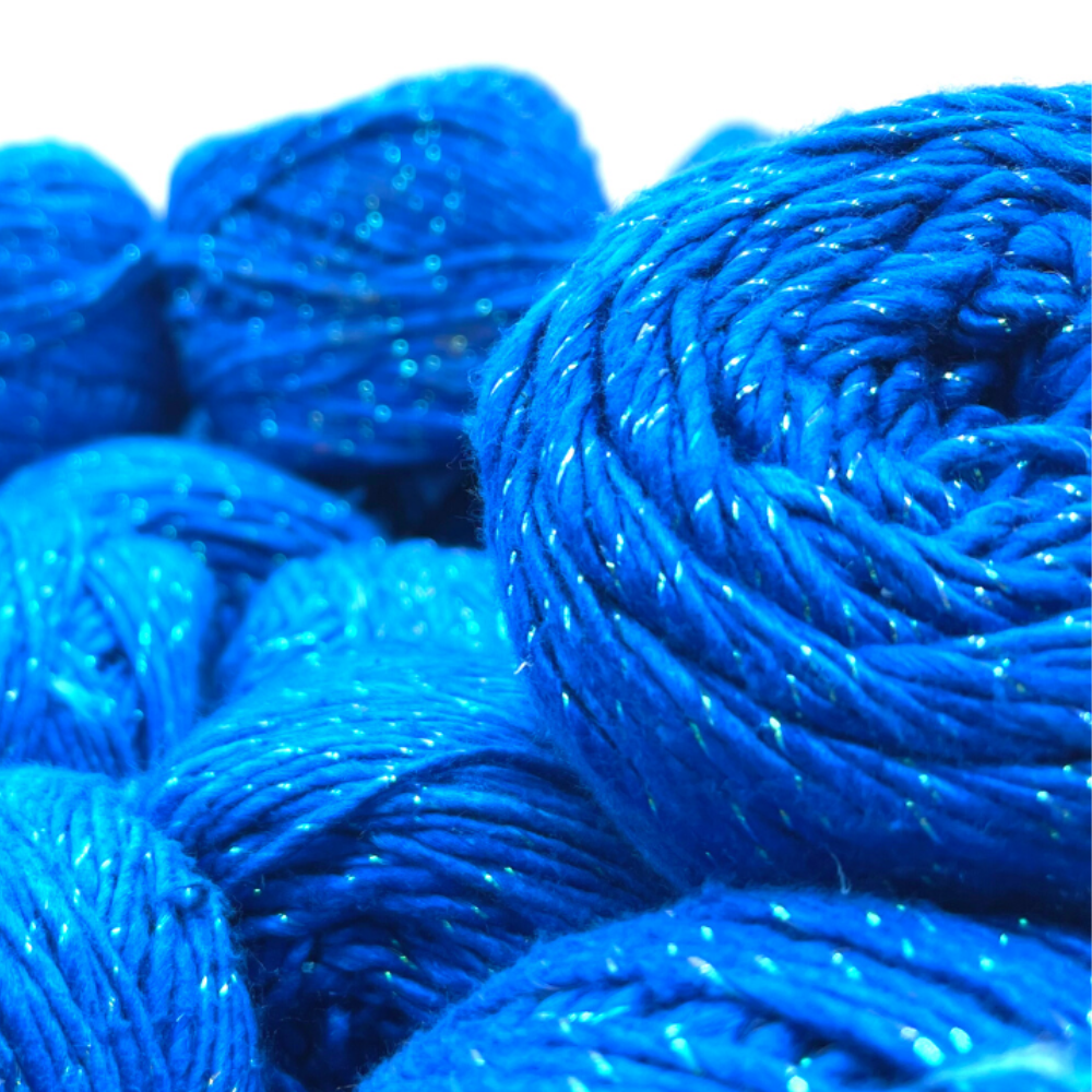 Bright blue yarn with a sparkly thread, ready for knitting or crochet projects.