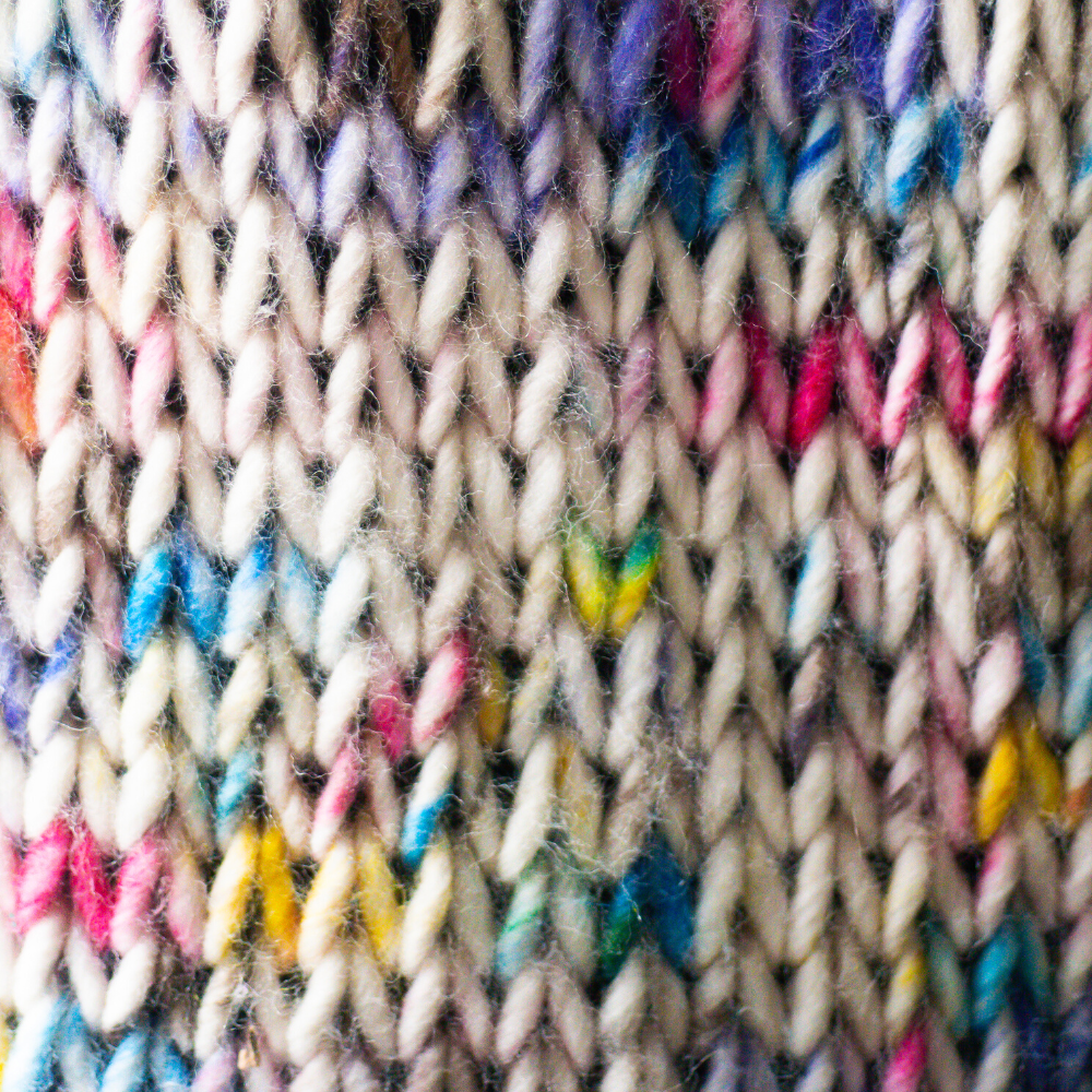 Colorful knitted pattern with various yarn colors