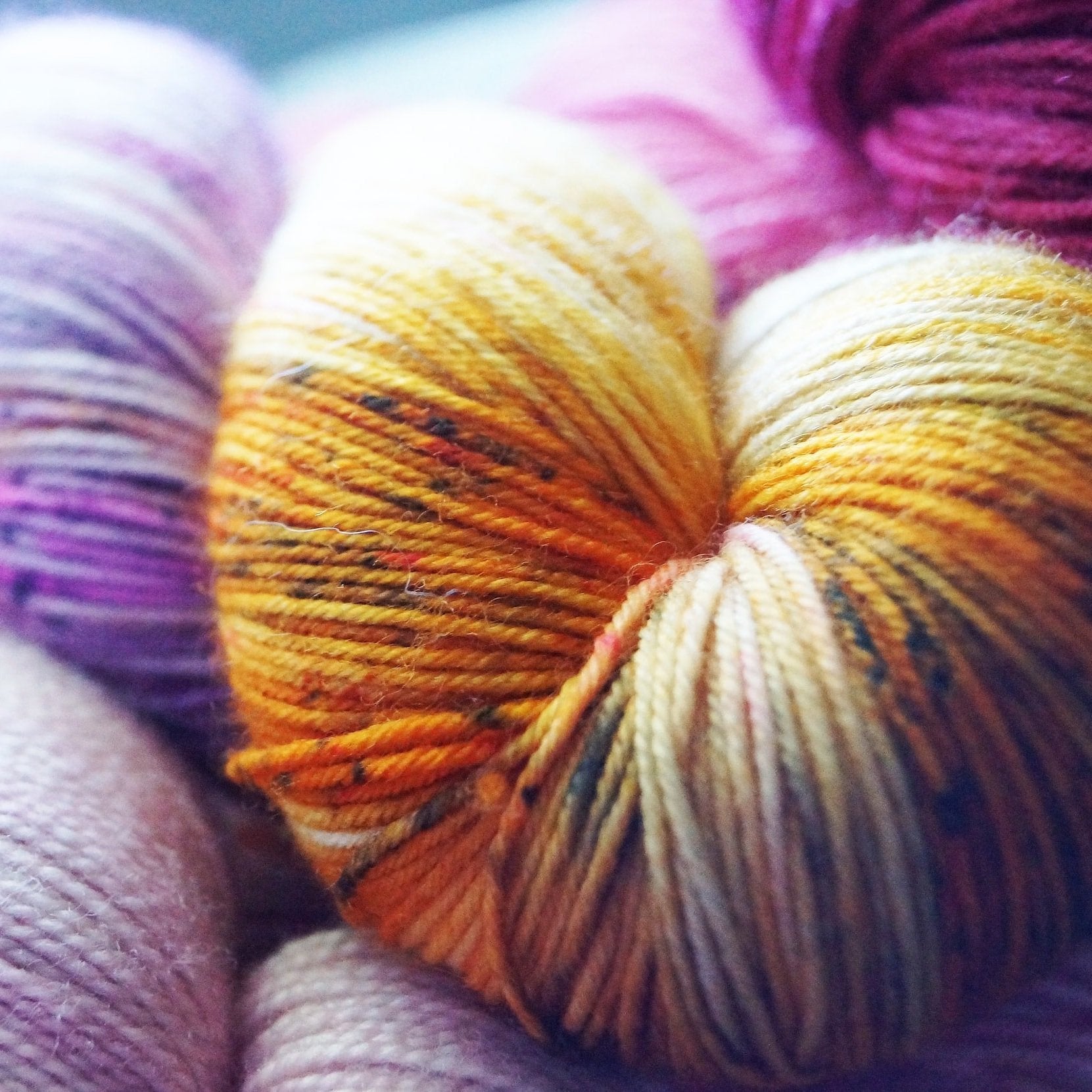 Close-up of colorful yarn that highlights sustainable knitting practices.