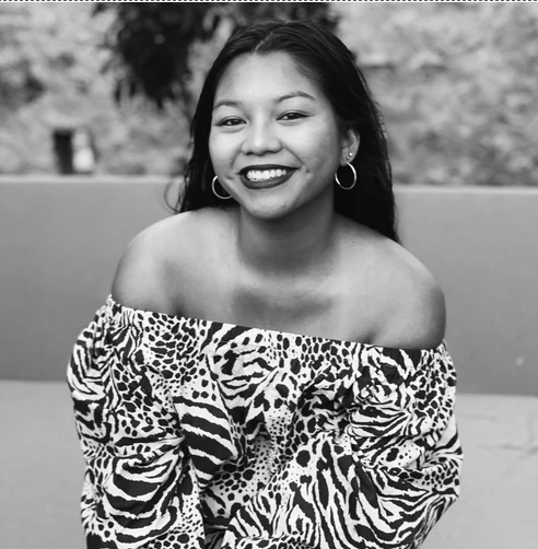 Smiling photo of Léna Maury n a leopard print top shares valuable knitting advice for new knitters