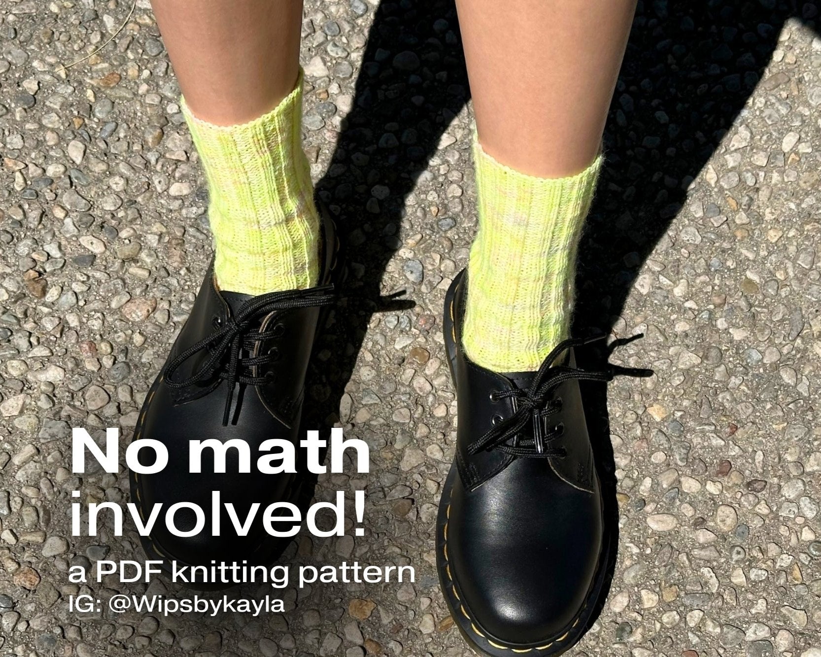 A person's legs in vibrant green socks with the phrase "No math involved!" using the Ribbed sock knitting pattern