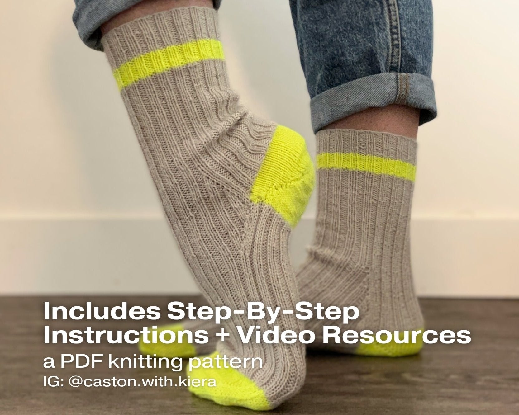 A person in gray and yellow socks displaying the phrase "Include step-by-step instructions and video resources" for the Ribbed Sock knitting pattern.
