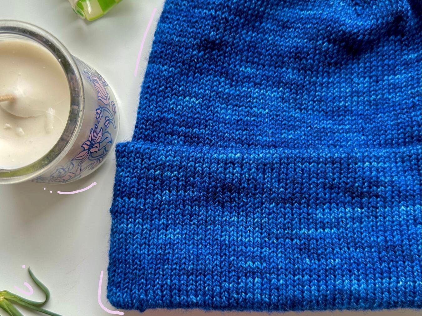 lifestyle image of the tall staple beanie which is included in the bundle